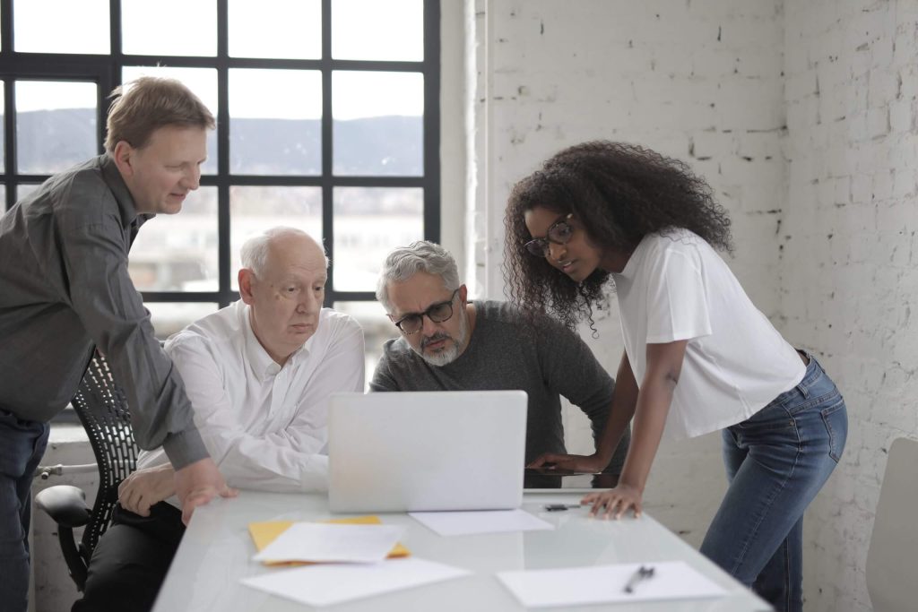 four people talking marketing research pre seed startup funding