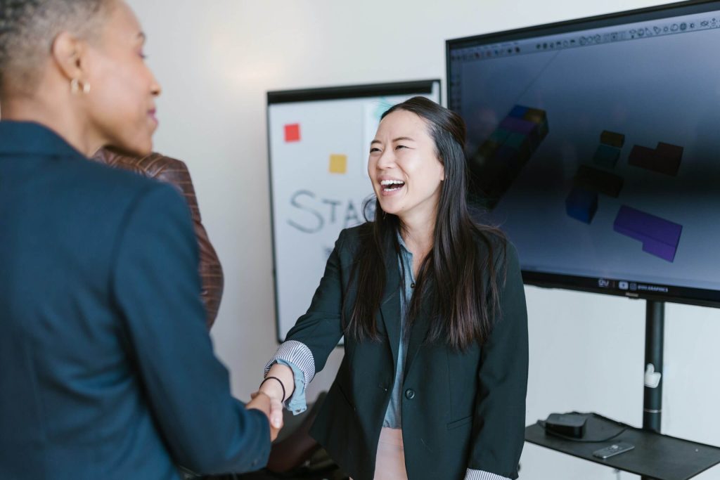 man and woman shaking their hands pre seed funding investors 1