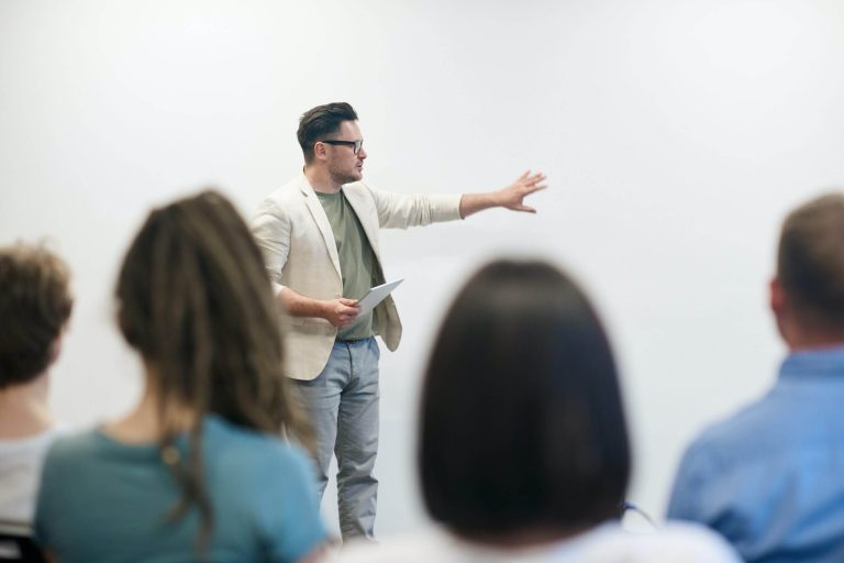 professional talking in front of the people looking for angel investors