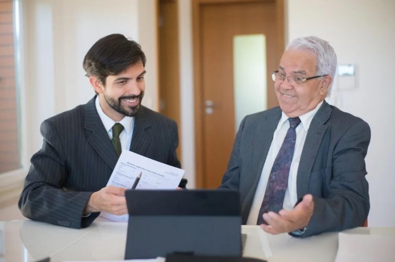 two men in front of a tablet angel investors las vegas