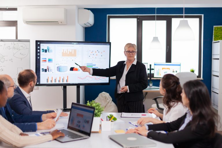 Senior woman company leader brainstorming in conference room